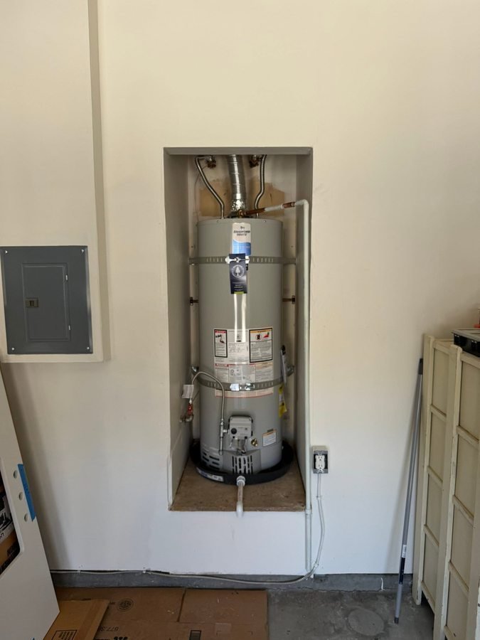 Tank water heater in a recessed utility space