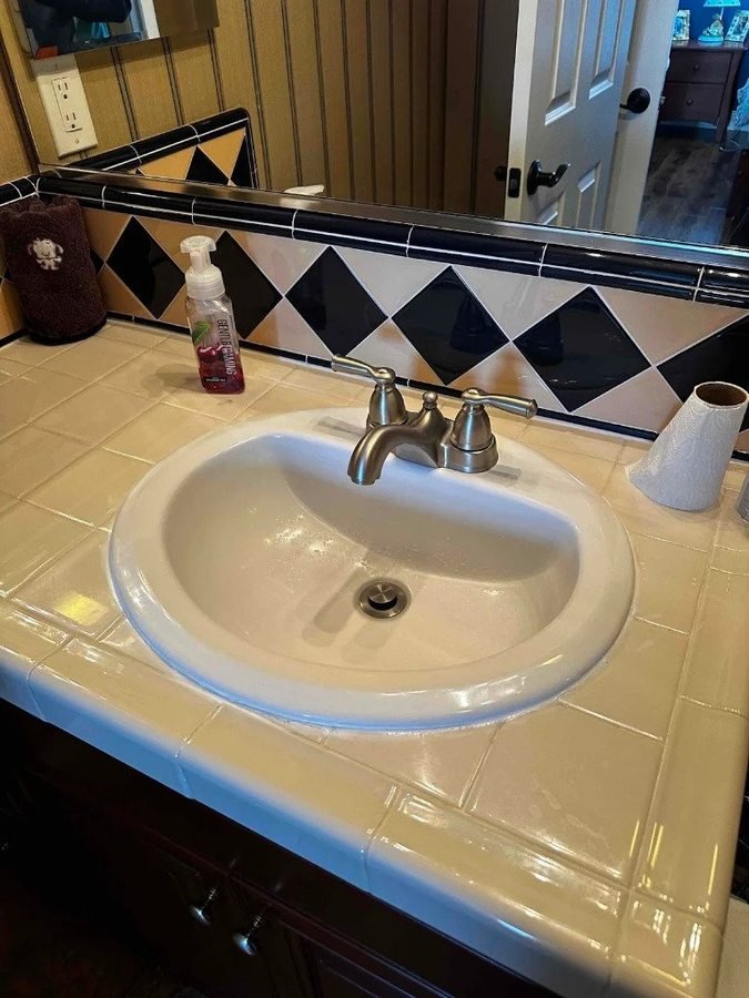 Bathroom sink with a two-handle faucet