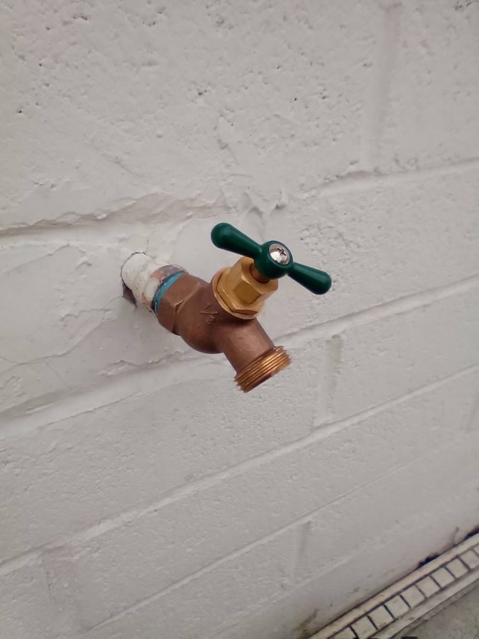 Outdoor hose bib and wall connection