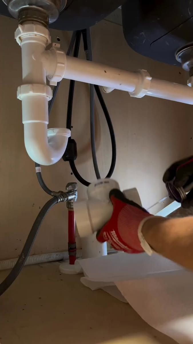 Kitchen sink P-trap and dishwasher hose during plumbing work